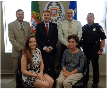 Members of the diplomatic team in the Palm Coast office of the Honorary Consulate of Portgual are, standing, from left, Eugenio Marques, vice consul; Caesar DePaço, honorary consul; Eddie Branquinho, assistant to the consul; Flagler County Sheriff’s Deputy Joseph Barnett; seated, from left, Marielena Dias, receptionist and assistant to consul; and Belmira Costa, technical assistant.